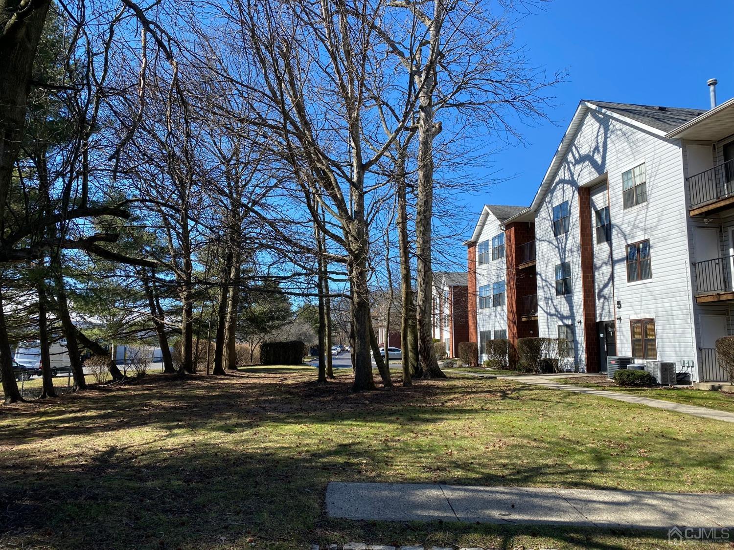 51 Boulder Drive Edison, NJ 08817 - Photo 22 of 24 a view of swimming pool with outdoor seating and covered with trees