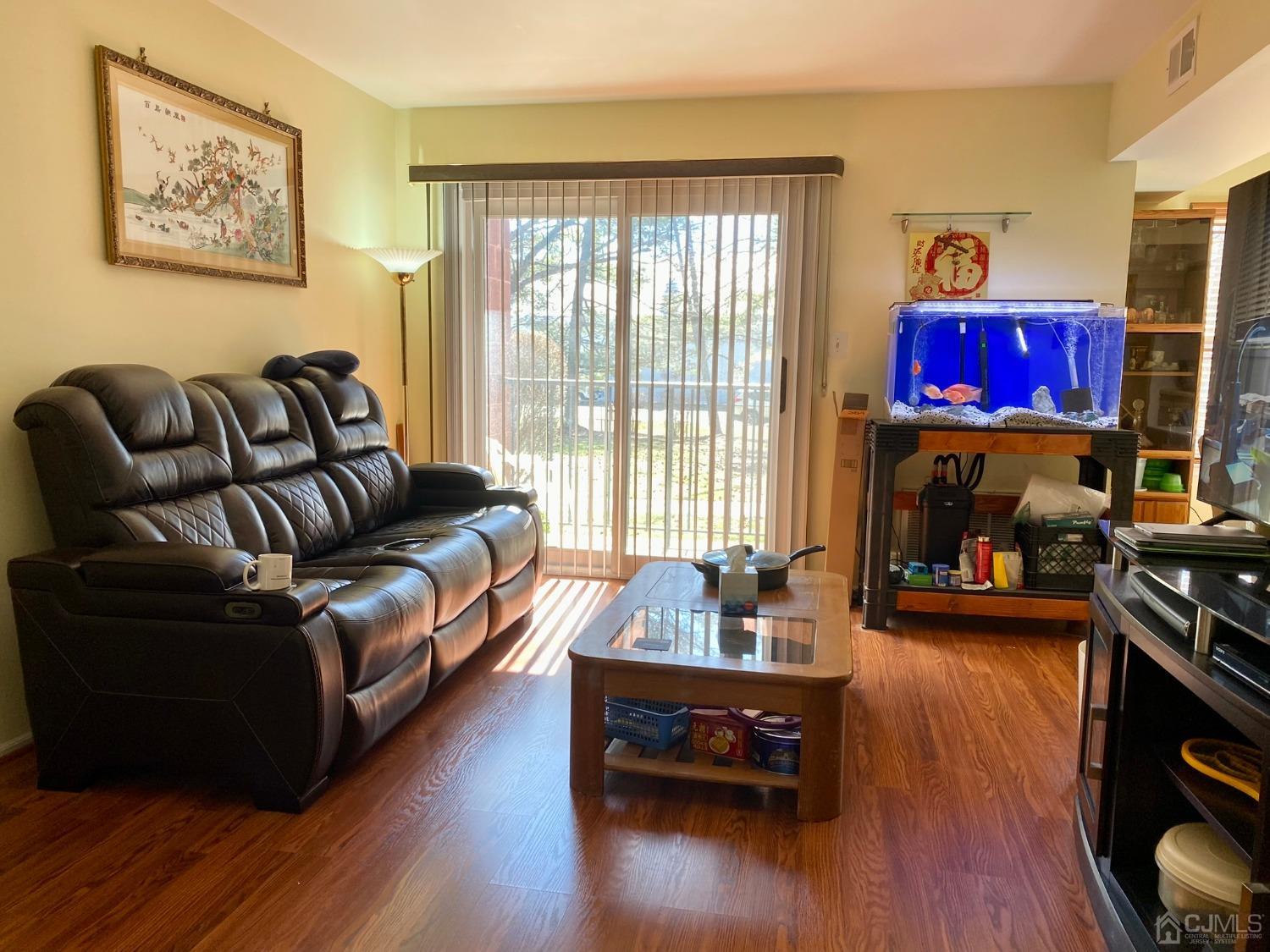 51 Boulder Drive Edison, NJ 08817 - Photo 4 of 24 a living room with furniture and a wooden floor