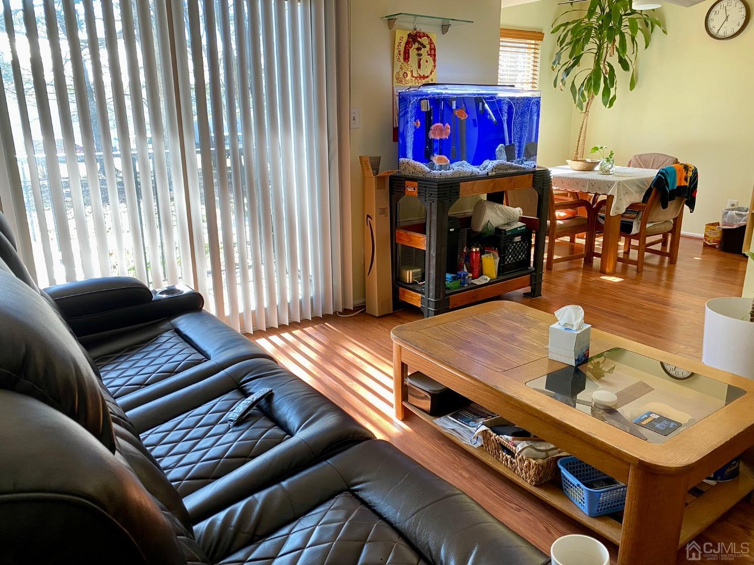 51 Boulder Drive Edison, NJ 08817 - Photo 5 of 24 a living room with furniture and a fireplace
