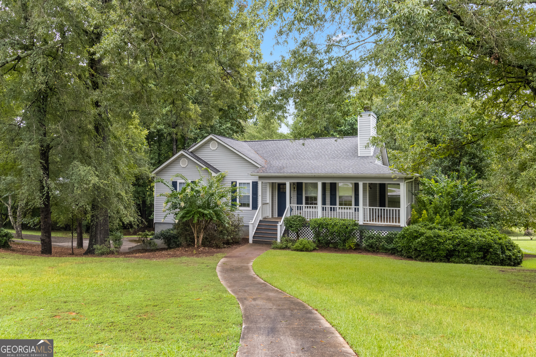 a view of a house with a garden