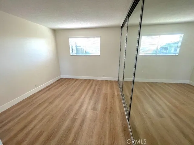 a bathroom with a double vanity sink a mirror and a bathtub