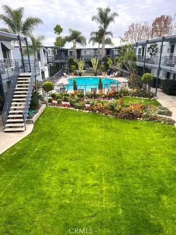 a view of a patio with a table and chairs
