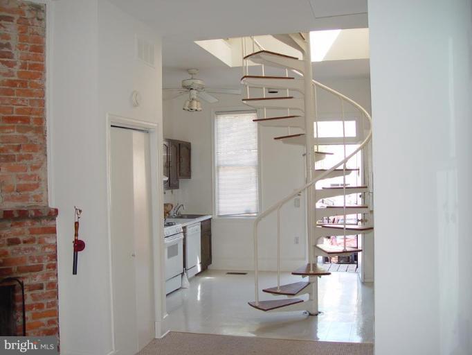 2129 N Street Northwest Washington, DC 20037 - Photo 2 of 14 Unit 2 living room/stair to 2nd floor bedroom