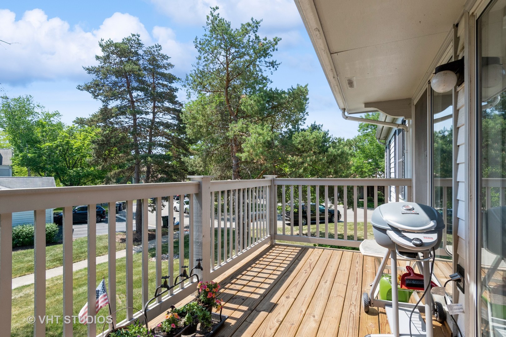 2124\ Lancaster Circle, Unit 202A Naperville, IL 60565 - Photo 11 of 14 a view of balcony with wooden floor and outdoor seating