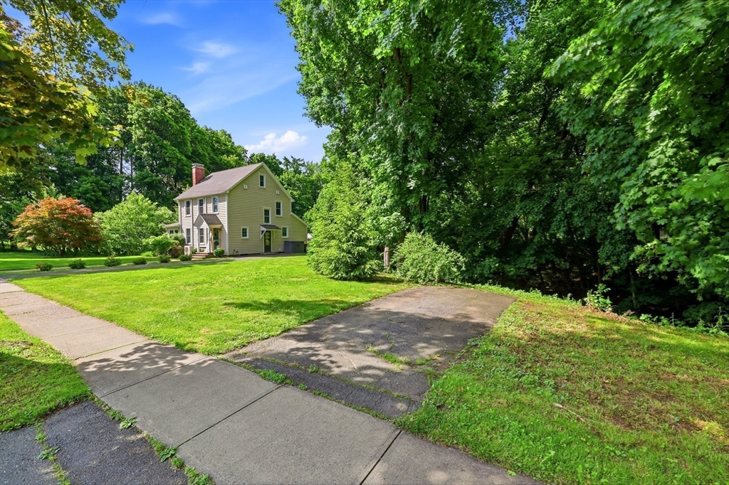 32 Lincoln Road Longmeadow, MA 01106 - Photo 5 of 36 a view of a house with a yard