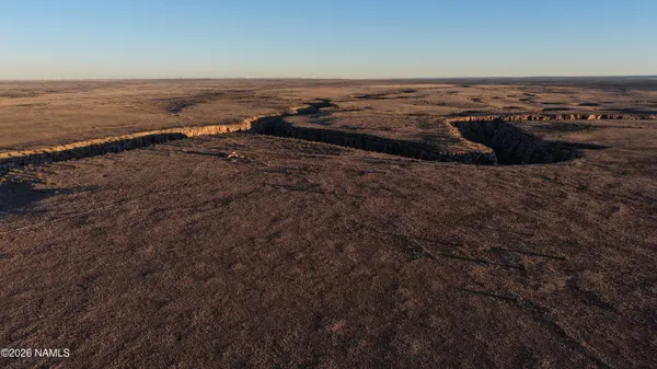 an aerial view of beach and ocean
