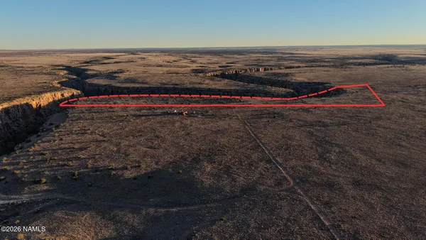 an aerial view of beach and ocean