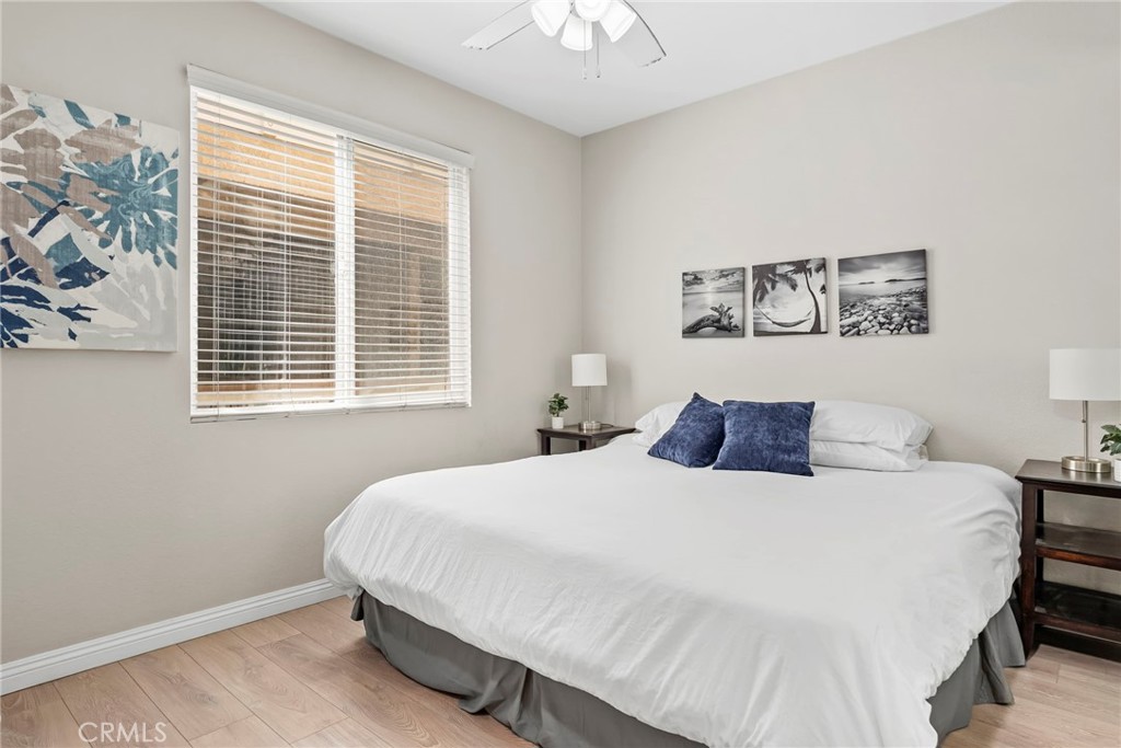 2000 Pacific Coast Highway, Unit 102 Huntington Beach, CA 92648 - Photo 15 of 35 a bedroom with a bed and a window