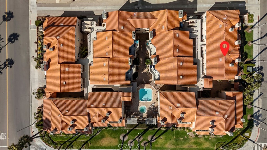 2000 Pacific Coast Highway, Unit 102 Huntington Beach, CA 92648 - Photo 26 of 35 an aerial view of residential houses with outdoor space