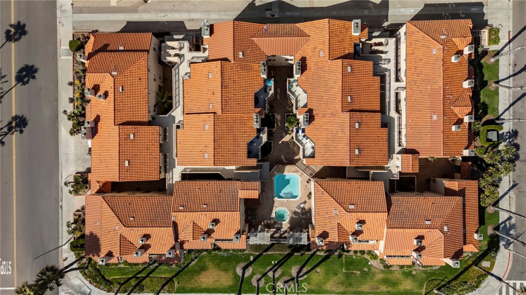 2000 Pacific Coast Highway, Unit 102 Huntington Beach, CA 92648 - Photo 27 of 35 an aerial view of residential houses with outdoor space