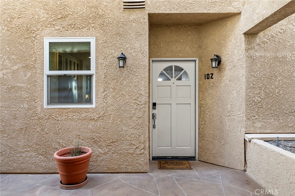 2000 Pacific Coast Highway, Unit 102 Huntington Beach, CA 92648 - Photo 3 of 35 a bathroom with a toilet and a sink