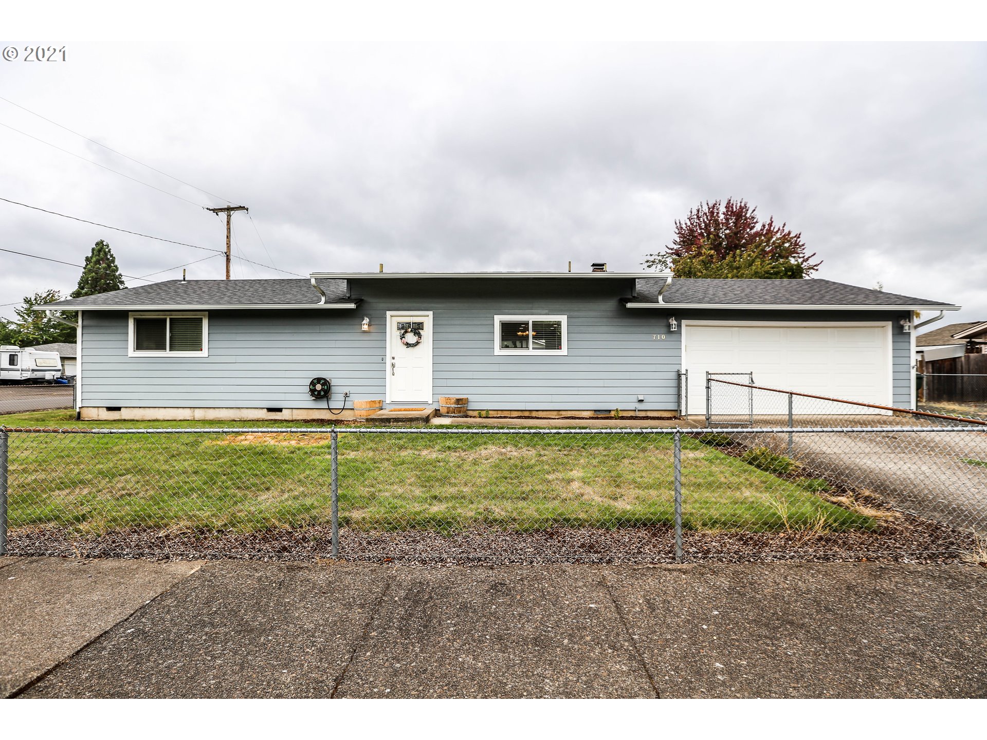 710 53rd Street Springfield, OR 97478 - Photo 1 of 16 a view of a house with a swimming pool