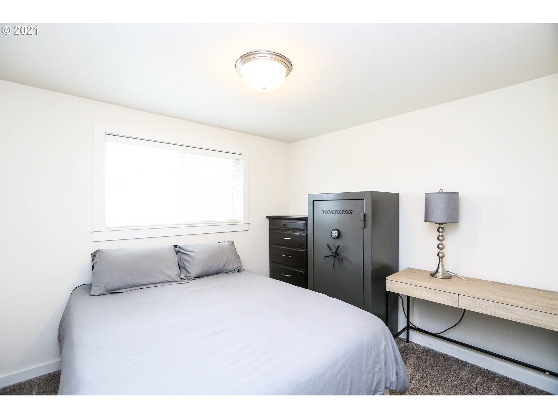 710 53rd Street Springfield, OR 97478 - Photo 12 of 16 a bedroom with a bed and cabinet
