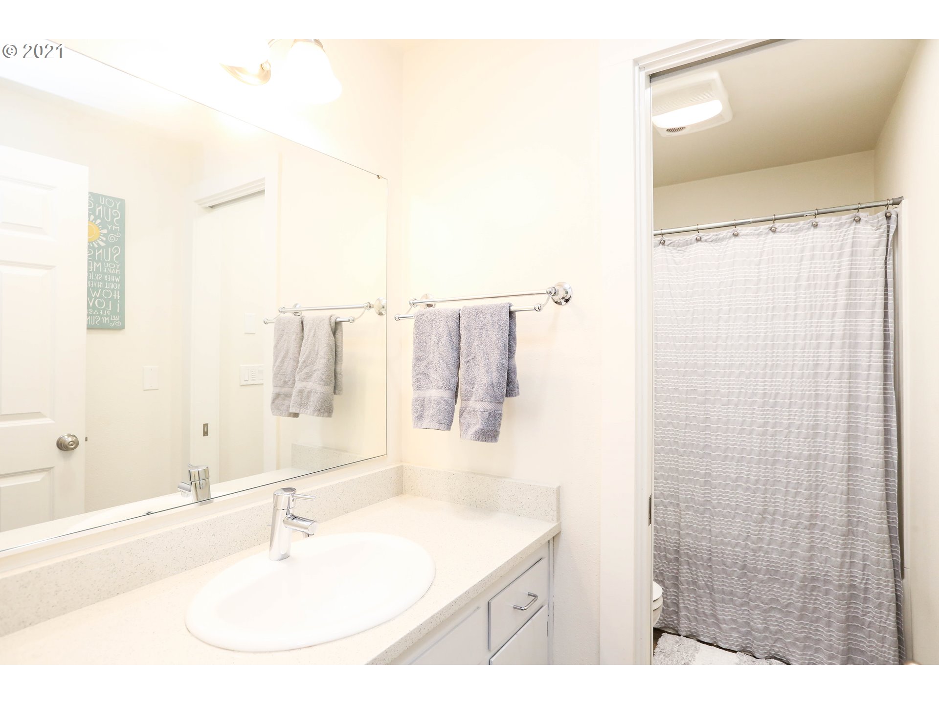 710 53rd Street Springfield, OR 97478 - Photo 14 of 16 a bathroom with a sink and a mirror
