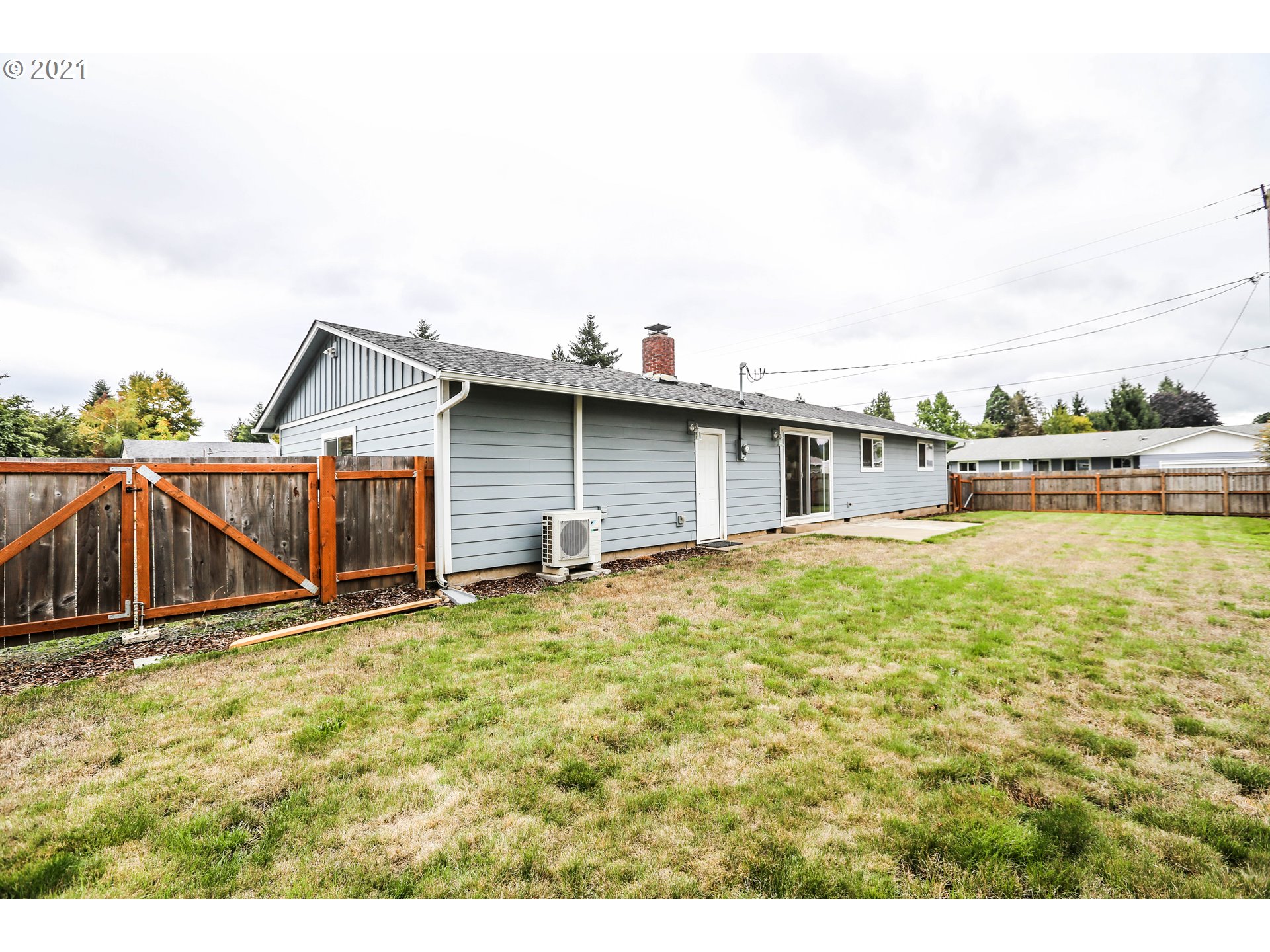 710 53rd Street Springfield, OR 97478 - Photo 15 of 16 a view of an house with backyard space and balcony