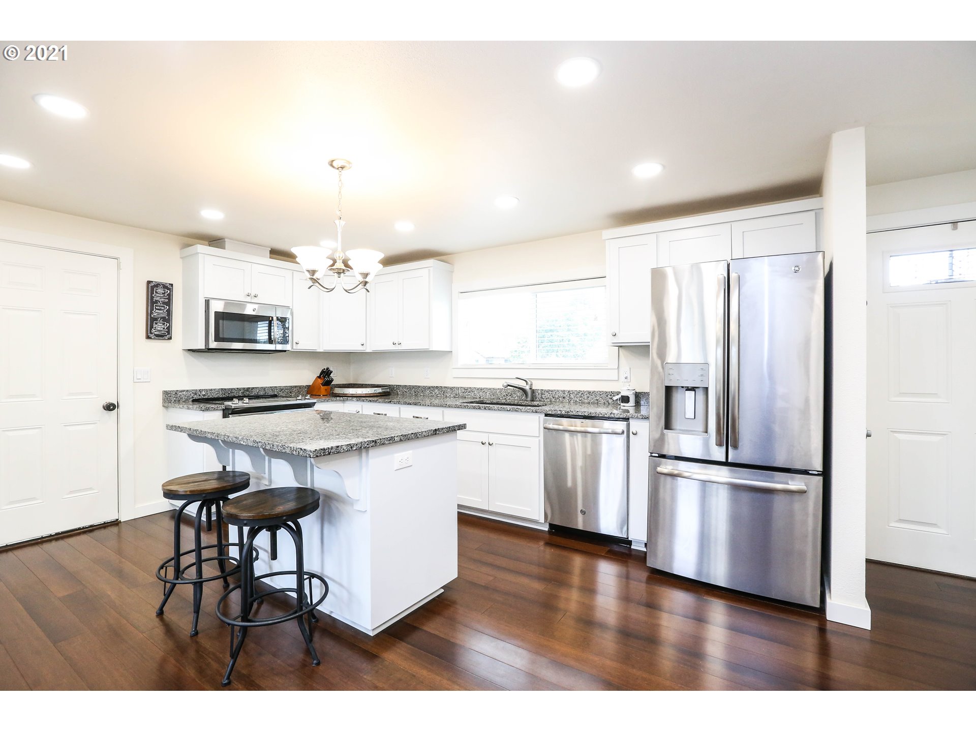 710 53rd Street Springfield, OR 97478 - Photo 5 of 16 a kitchen with stainless steel appliances granite countertop a refrigerator and a stove top oven