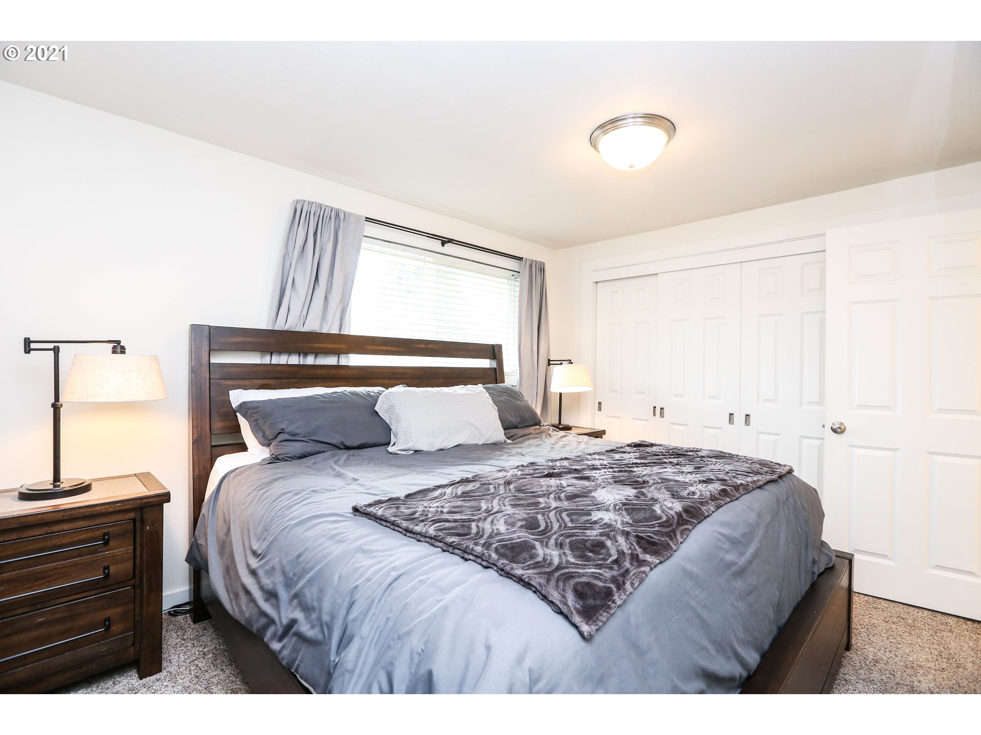 710 53rd Street Springfield, OR 97478 - Photo 9 of 16 a bedroom with a bed and a window