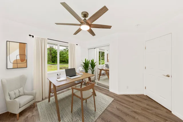 a workspace with furniture and a window