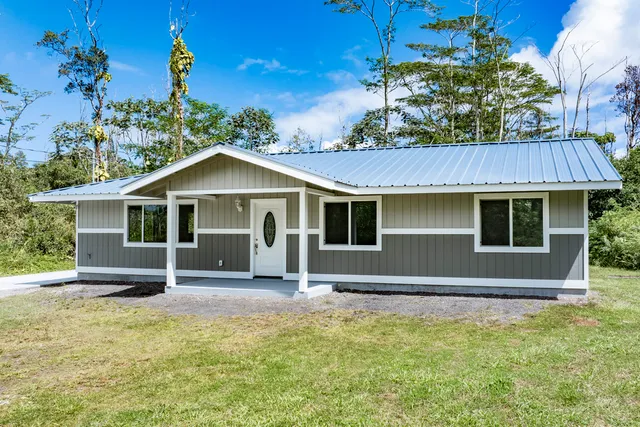 a front view of a house with yard