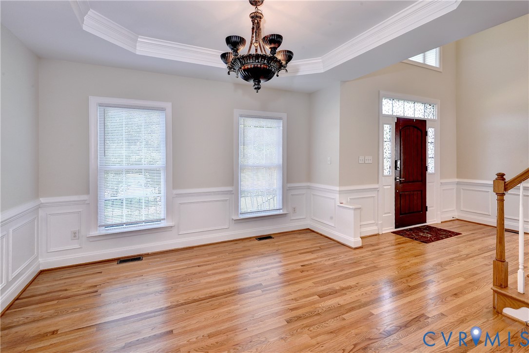 11385 Winding River Road Providence Forge, VA 23140 - Photo 13 of 43 a view of an empty room with a window and wooden floor