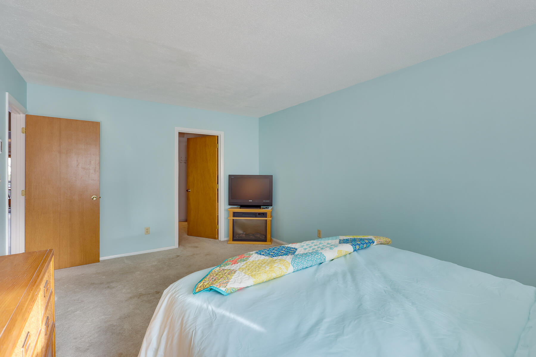 18 Round House Road Monument Beach, MA 02532 - Photo 12 of 16 a bedroom with a bed and a painting on the wall