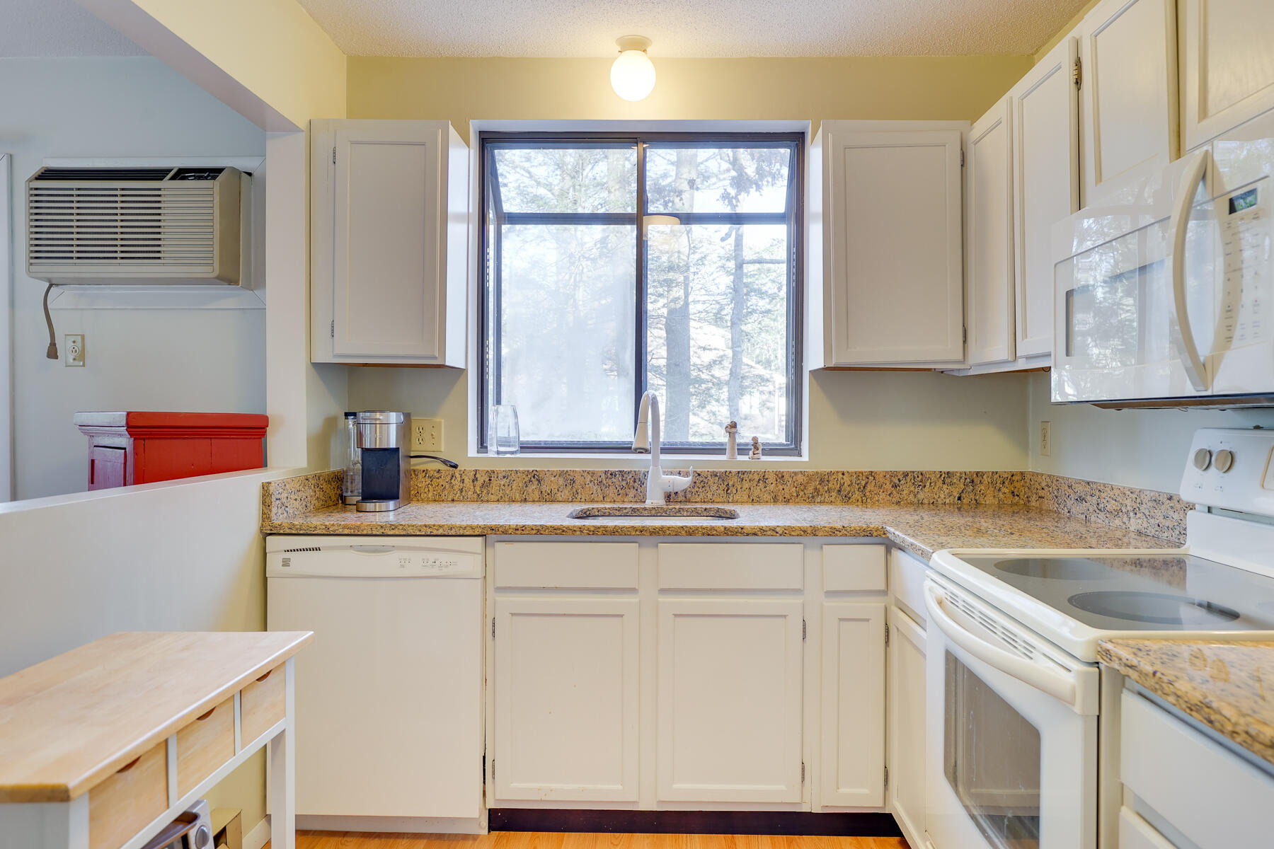 18 Round House Road Monument Beach, MA 02532 - Photo 9 of 16 a kitchen with stainless steel appliances granite countertop a sink and a stove next to a window