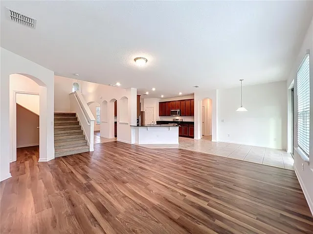 a view of kitchen with furniture and wooden floor