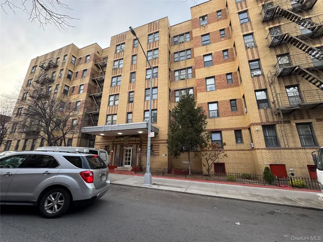 a view of a building and a parking space