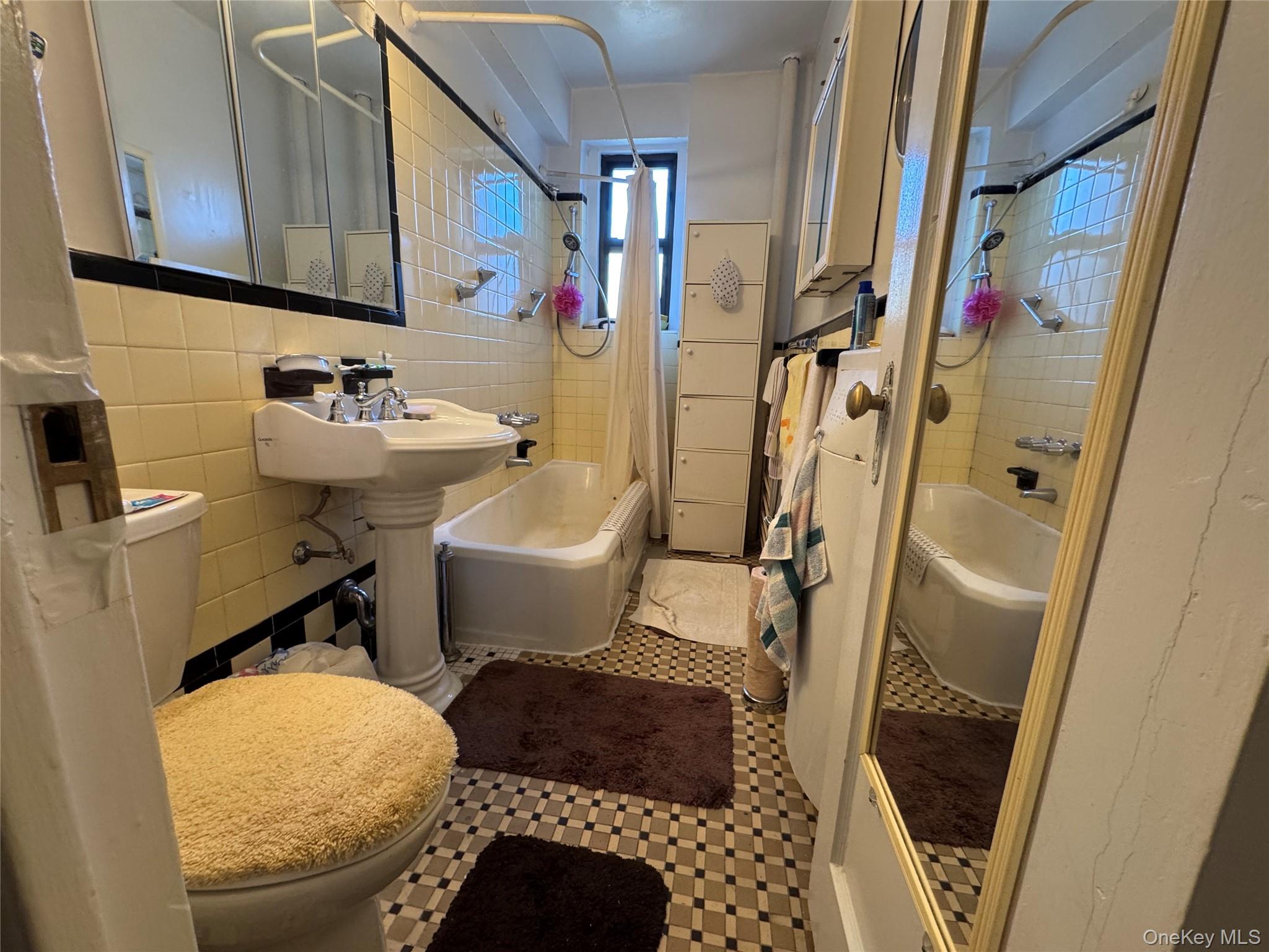 43-30 44th Street, Unit 3F Queens, NY 11104 - Photo 11 of 11 a bathroom with a sink toilet and shower