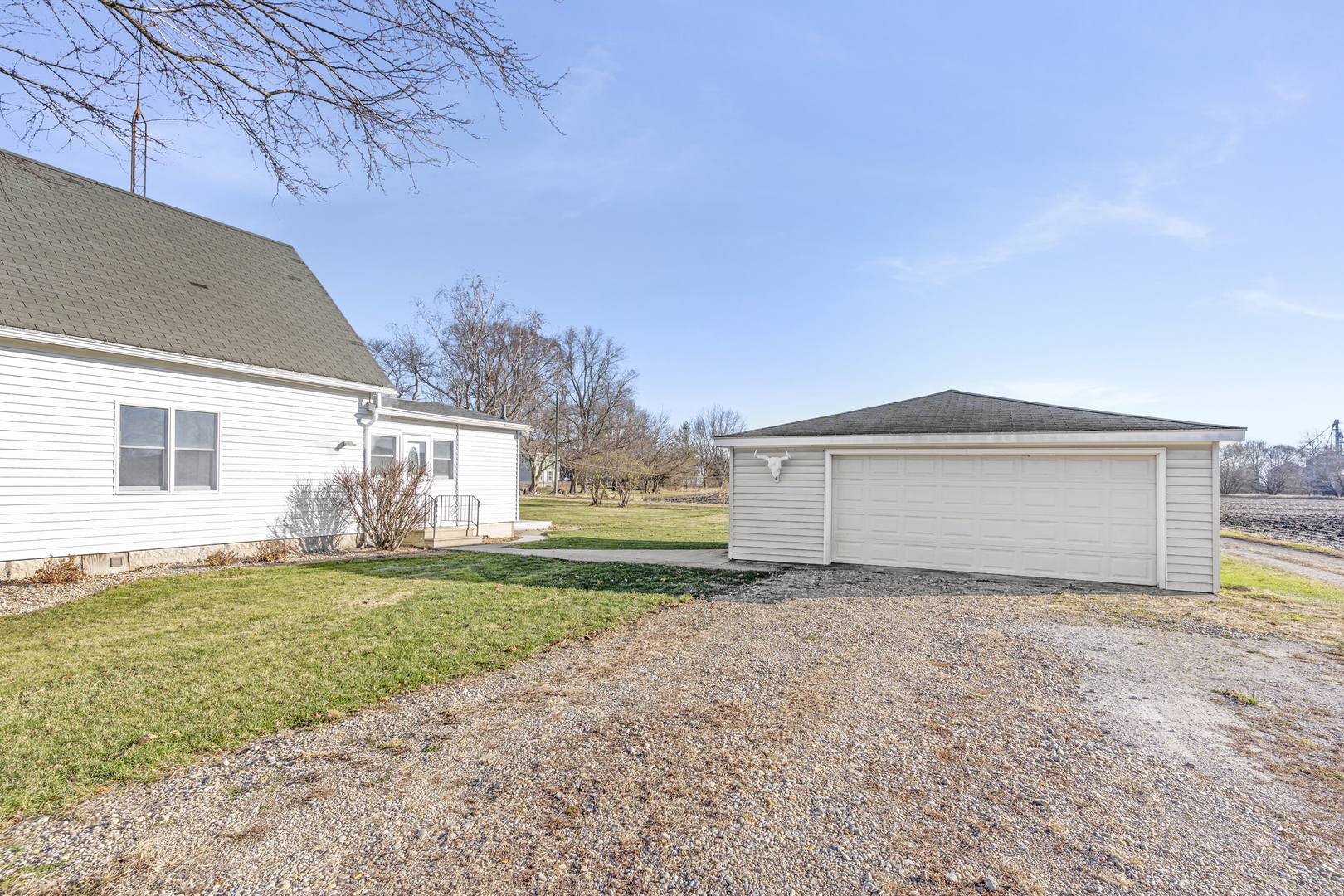 402 Center Street Mazon, IL 60444 - Photo 14 of 15 a view of a house with a yard and garage