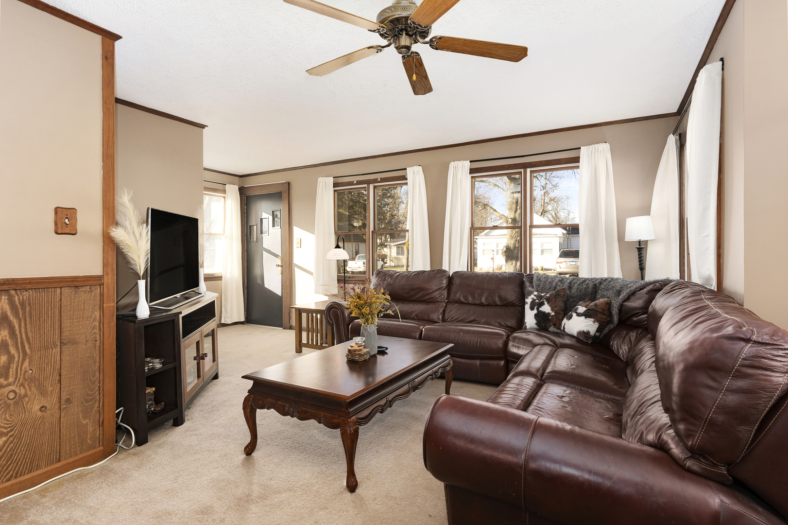 402 Center Street Mazon, IL 60444 - Photo 7 of 15 a living room with furniture a flat screen tv and a window