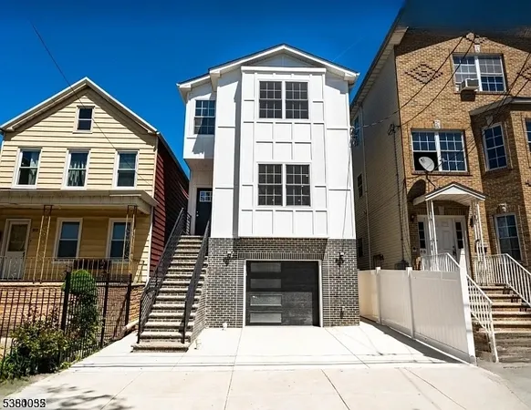 a front view of a house with glass windows