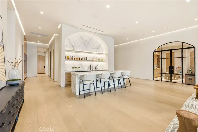 a dining room with furniture and a window