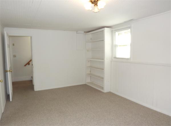 90 Holly Road Marshfield, MA 02050 - Photo 11 of 17 an empty room with a empty space and windows