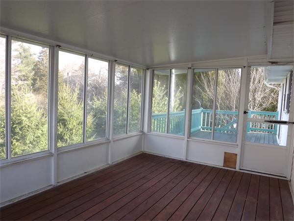 90 Holly Road Marshfield, MA 02050 - Photo 13 of 17 a view of an empty room with wooden floor and a window
