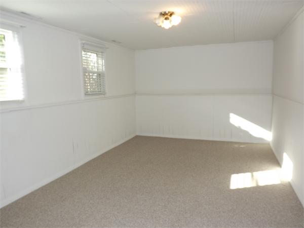 90 Holly Road Marshfield, MA 02050 - Photo 10 of 17 a view of empty room with windows