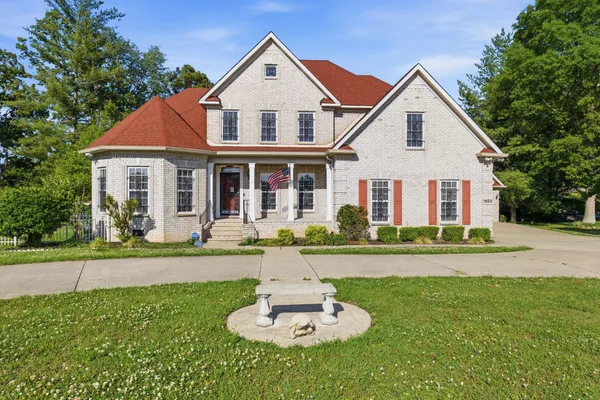a front view of a house with a yard