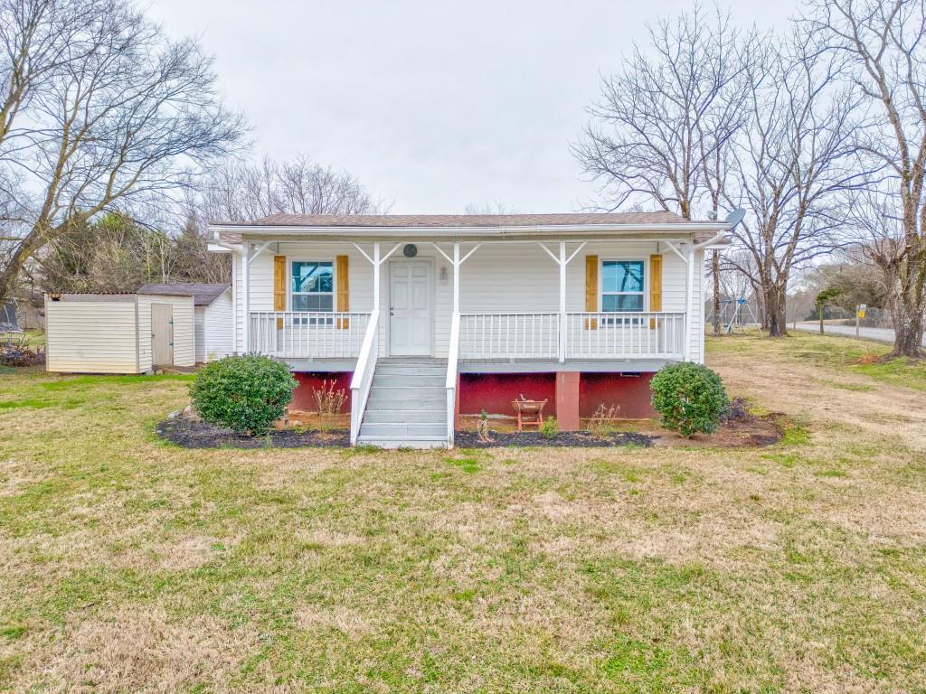 581 Folsom Road Fairmount, GA 30139 - Photo 1 of 1 a view of a house with a yard and garage
