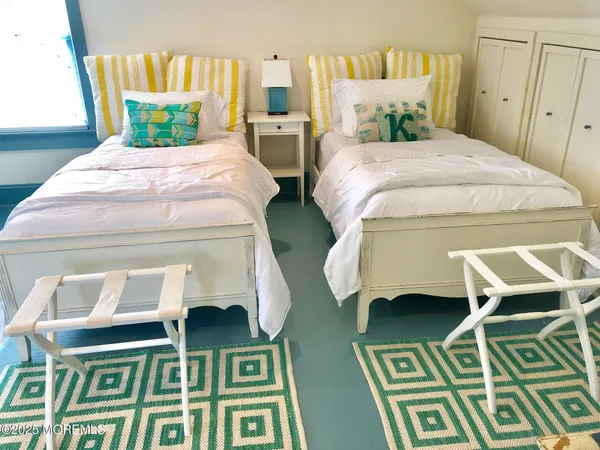 a bedroom with a bed and a table in it