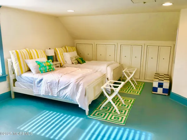 a bedroom with a bed and a table in it