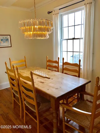 a view of a dining room with furniture and window