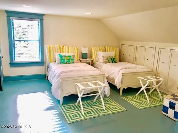 a bedroom with a bed and a table in it