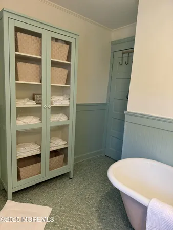 a bathroom with a tub and shower