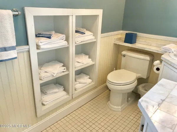 a bathroom with a toilet and a sink