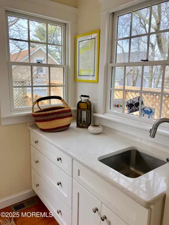 a kitchen with a sink and a window