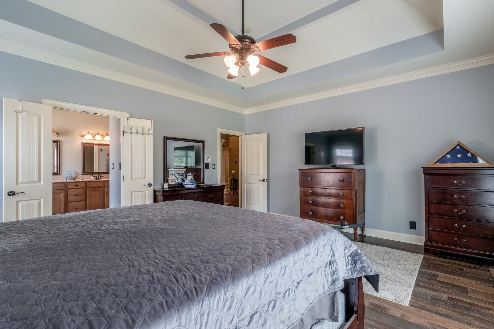 3592 Drake Road Adams, TN 37010 - Photo 21 of 47 a spacious bedroom with a bed and a flat screen tv