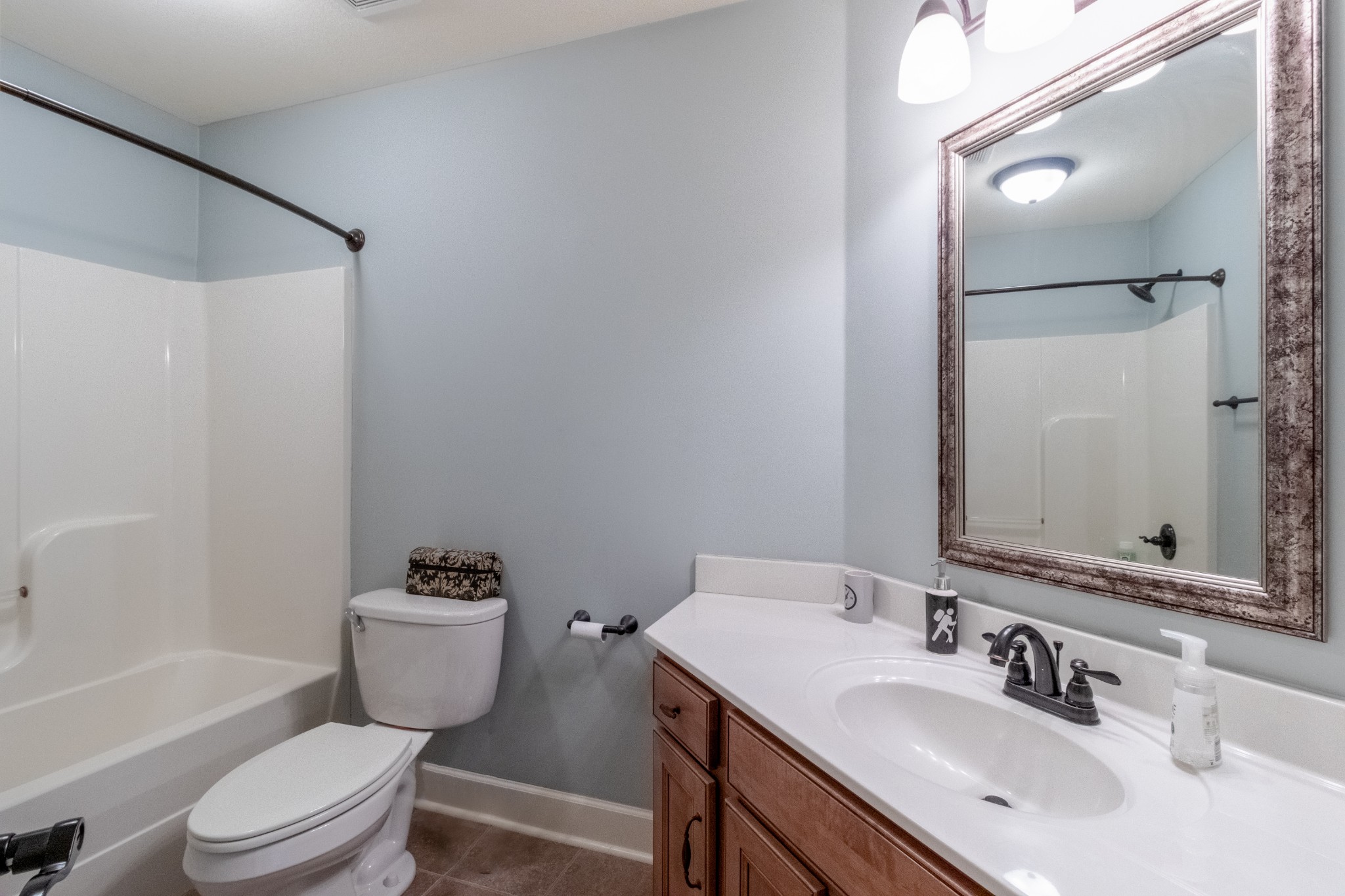 3592 Drake Road Adams, TN 37010 - Photo 30 of 47 a bathroom with a sink toilet a shower and a mirror