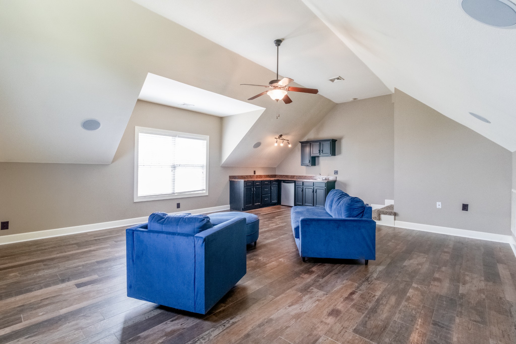 3592 Drake Road Adams, TN 37010 - Photo 33 of 47 a living room with couches and a dining table with wooden floor