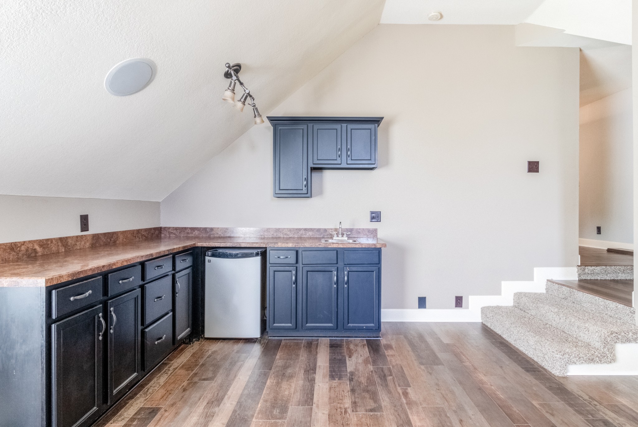 3592 Drake Road Adams, TN 37010 - Photo 35 of 47 a kitchen with a sink cabinets and wooden floor