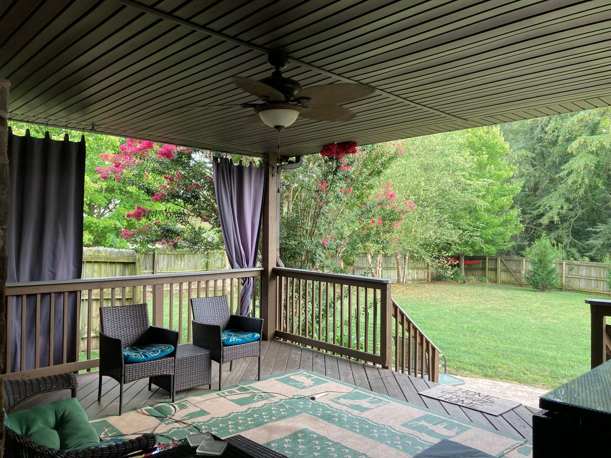 3592 Drake Road Adams, TN 37010 - Photo 39 of 47 a patio with wooden floor a yard tables and chairs